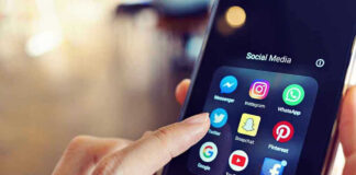 Finger tapping smartphone social media app icons