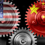 Interlocking gears with USA and China flags