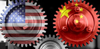 Interlocking gears with USA and China flags