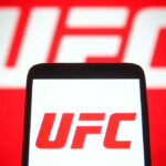UFC logo on phone screen and background