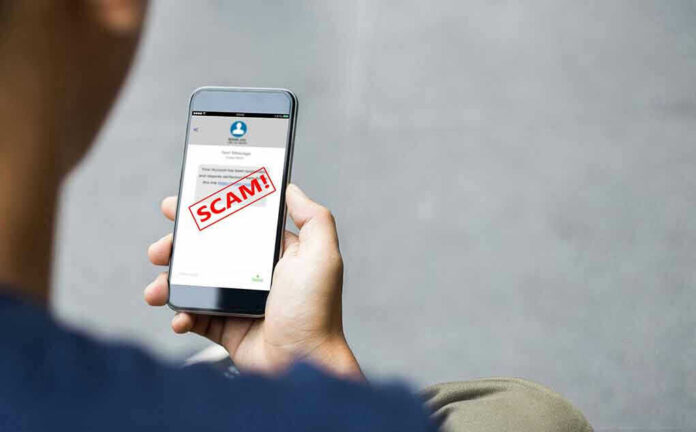 Person reading a scam message on a smartphone