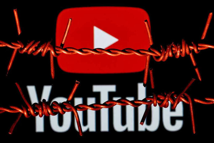 YouTube logo behind barbed wire lines