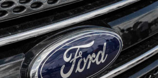 Ford logo on car grille close-up.