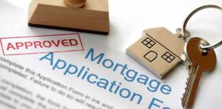 Approved mortgage application form with a house key and keychain