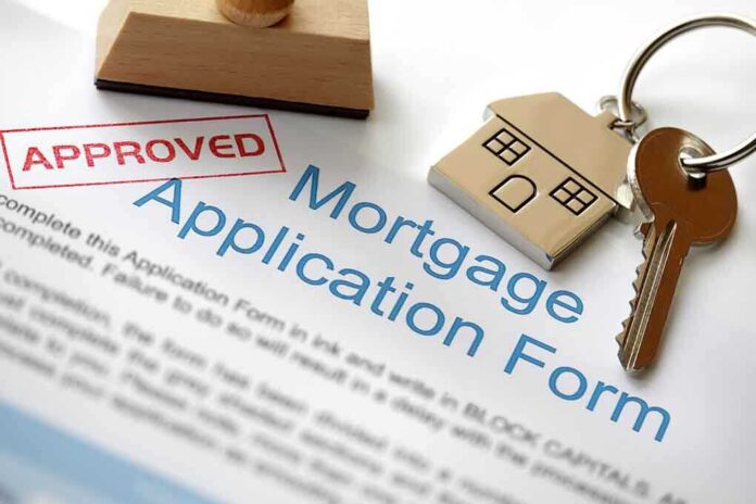 Approved mortgage application form with a house key and keychain