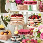 A beautifully arranged dessert table featuring various pastries and fruits