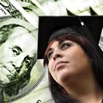 Young woman in graduation cap looking upward with money in the background