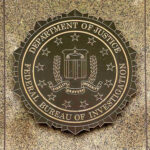 FBI seal on a marble wall