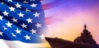 American flag overlaying warship at sunset