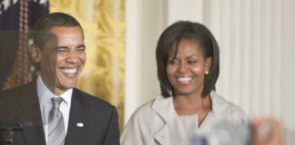 Former President Barack Obama and Michelle Obama smiling at a public event