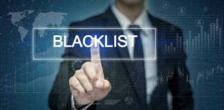 Man pressing virtual blacklist button