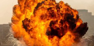 A large explosion creating a massive fireball and smoke