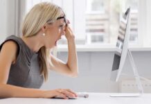 Car Wash SLAVERY BUST — Unbelievable! A woman with blonde hair showing a surprised expression while looking at a computer