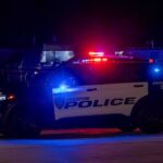 Meth Maniac Drags Cop from Patrol Car Houston police vehicle with emergency lights activated at night