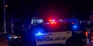 Houston police vehicle with emergency lights activated at night