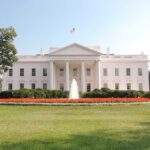 AOC’s SHOCKING Claim: “I’ll Stomp Vance!” The White House surrounded by manicured gardens and a fountain