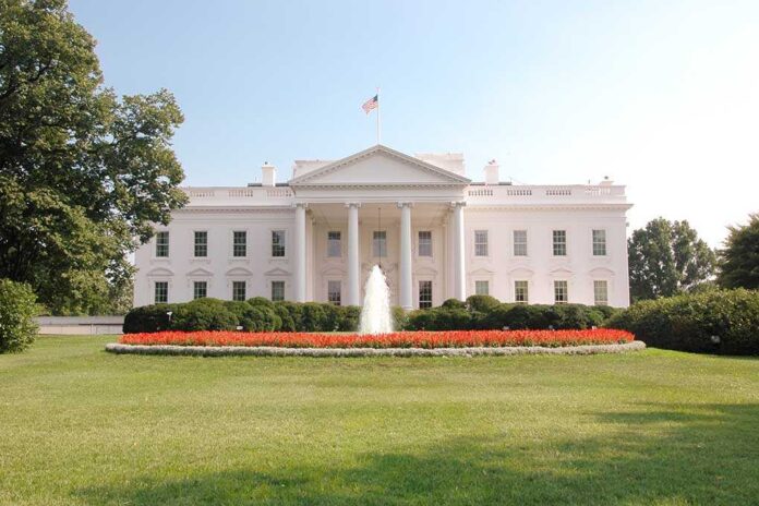 shutterstock_92422096.jpg The White House surrounded by manicured gardens and a fountain