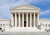 SCOTUS Verdict In On Last Minute Death Row Appeal Front view of the Supreme Court building with large columns and steps under a blue sky