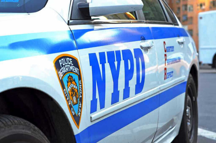 1910596186 NYPD police car with logo and text.