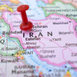 Fear Grips Iran: Execution Rate Skyrockets Red pushpin marking Iran on a map.