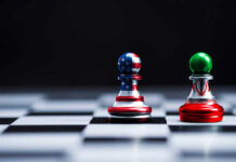 IRAN DEAL: Trump’s Next Move Could Change Everything Chess pieces with USA and Iran flags on board.