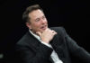 Jury Blocks Musk’s Fight Against OpenAI – Truth Still Hidden Man in suit smiling, resting chin on hand.
