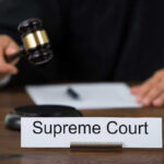 Supreme Court BOMBSHELL: Murdaugh Conviction OVERTURNED! Judge with gavel and Supreme Court nameplate.