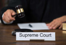 Supreme Court BOMBSHELL: Murdaugh Conviction OVERTURNED! Judge with gavel and Supreme Court nameplate.