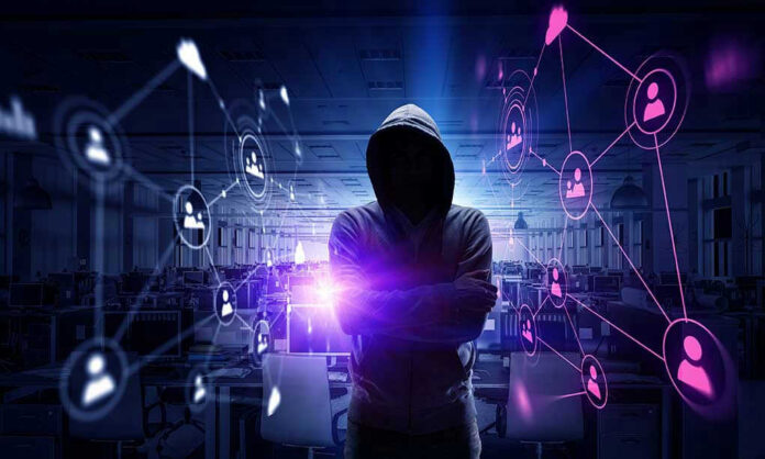635529080 Hacker in hooded sweatshirt with digital connections overlay.