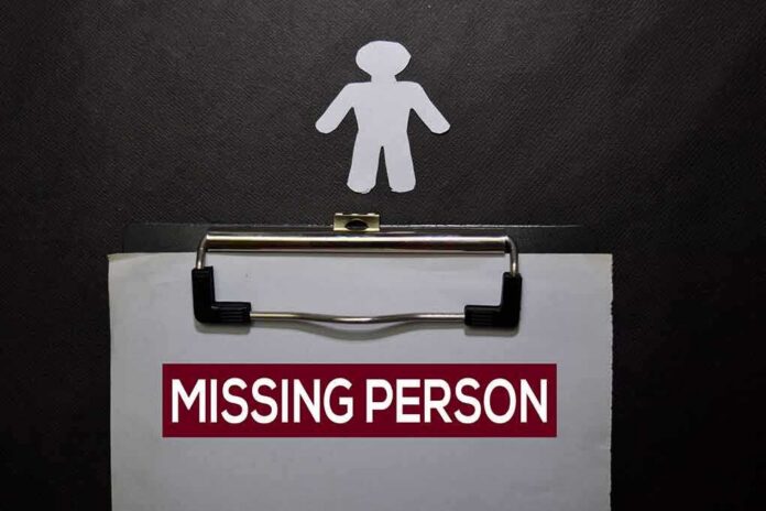 Clipboard with a missing person notice and a paper cutout figure