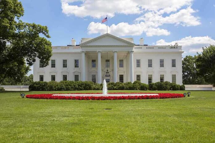 shutterstock_225269257 The White House with a fountain and flower beds in front