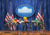 Trump Freezes Strikes — Iran Calls It Fiction Multiple microphones at White House press briefing podium.