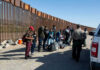 ICE, Border Patrol Get Years-Long Lifeline Border patrol agents interact with a group of people.