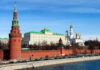 Putin’s ‘Peace’ Ultimatum Stuns Analysts The Kremlins towers and cathedrals beside a river.