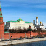 The Kremlins towers and cathedrals beside a river.