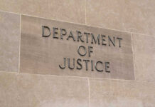 Department of Justice sign on a building.