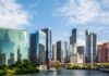 Chicago Icon Dangling For Sale Chicago skyline featuring modern skyscrapers along a river