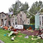 Mayor’s Brother Turns On LA Houses with significant storm damage and debris scattered around the yard