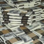 Piles of bundled cash stacked together