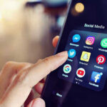 Injury Excuse, Internet Outrage Collide Finger tapping smartphone social media app icons.