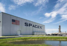 Ignition Fails — Musk’s Big Bet Pauses SpaceX building with American flag and launch pad.