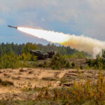 Deterrence Theater Backfires — What’s The Plan? Military tank firing a missile in forest area.