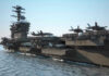 Iran Strikes Ships — U.S. Hammers Back Aircraft carrier deck with jet planes.