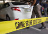 Heatwave Horror Exposes Babysitting Blind Spot Crime scene tape blocking off white sedan.