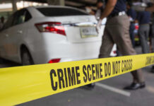 Heatwave Horror Exposes Babysitting Blind Spot Crime scene tape blocking off white sedan.