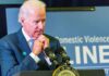Privacy Crumbles — Biden Audio Goes Public man at podium speaking with hands clasped near chin