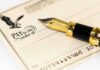 Border Crackdown Gets Blank Check Close-up of a check with a fountain pen and an eagle illustration