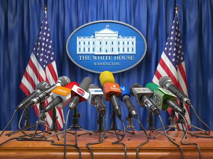 Press microphones at a White House briefing podium