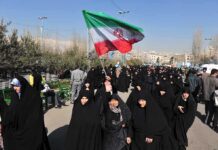 State Funeral, Open Trump Death Calls Group of women in black attire marching with an Iranian flag