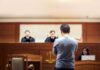 Tupac Murder Trial Twist: No Gun, No DNA defendant stands before judges in a courtroom